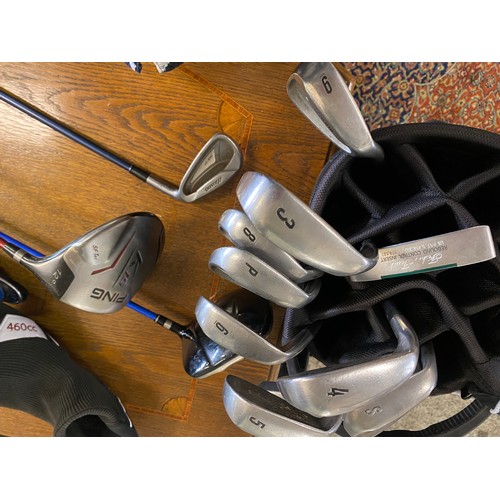 114 - A Motocaddy golf bag and golf clubs