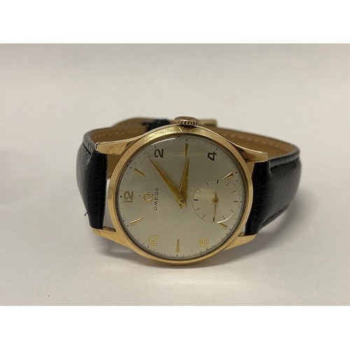 270 - A gentleman's Omega wristwatch, circular dial, seconds dial, in a 9ct. gold case on a black leather ... 