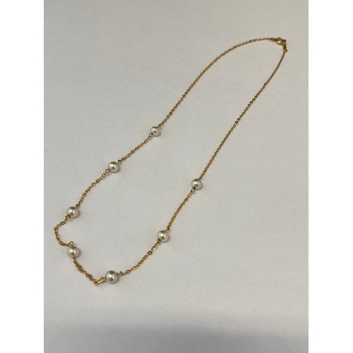 236 - A 9ct. gold necklace with pearl spacers