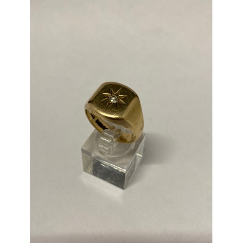 267 - A gentleman's heavy 9ct. gold signet ring, the top set diamond