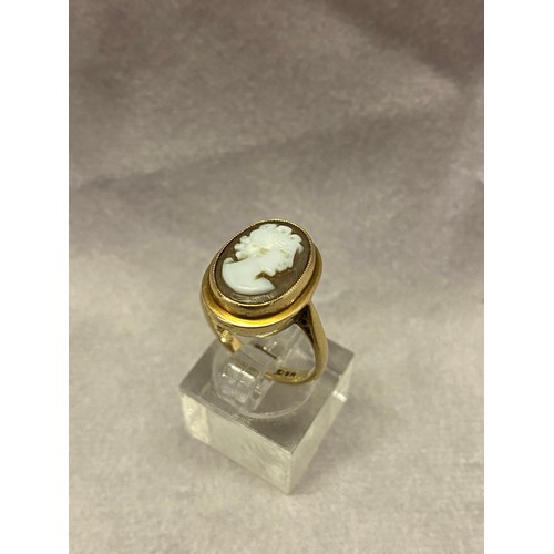 274 - A lady's ring set carved shell cameo, on a 9ct. gold shank