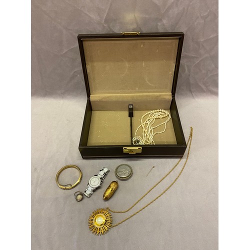 239 - A brown jewellery box containing a lady's Tissot wristwatch in a white and steel case, a carved shel... 