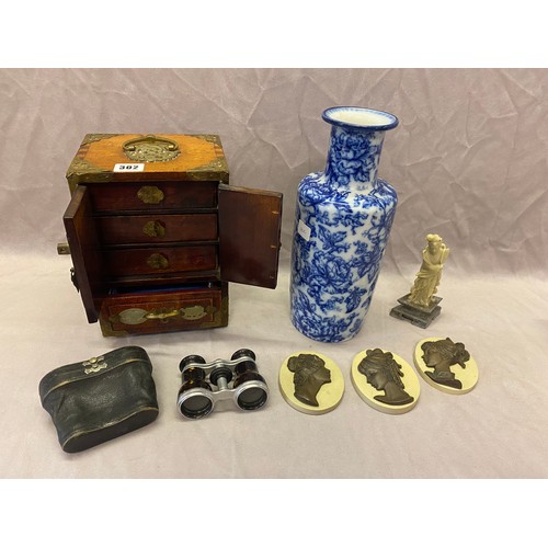 302 - A small Chinese cabinet, a pair of opera glasses, three portrait plaques, Losol Ware vase and a soap... 