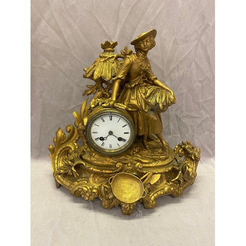 301 - A late 19th Century French mantel clock, white enamel dial, in a gilded spelter case with female fig... 