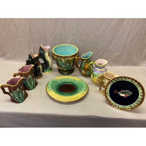 143 - A selection of majolica including a plate decorated fish to the centre by J Holcroft - 9in. dia., tw... 