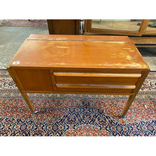 48 - A teak sewing box with hinged lid enclosing fitted interior - 29in. wide