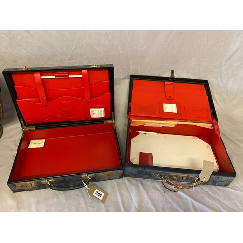 304 - Two small leather stationery cases with red leather interiors - 14in. wide