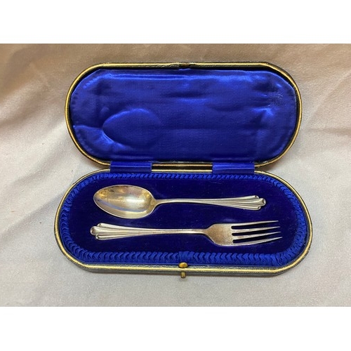 187 - A silver christening spoon and fork, in fitted leather case - Sheffield 1915, makers marks for John ... 