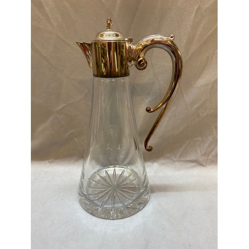 194 - A tapering glass claret jug with sterling silver mounts, a glass ice bucket with silver handle and a... 