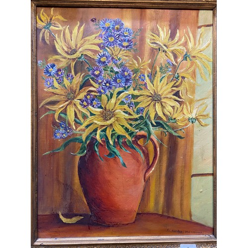 8 - M. Meadows.  A signed oil on canvas - Still life of flowers in a terracotta jug, framed - 17 1/2in. ... 