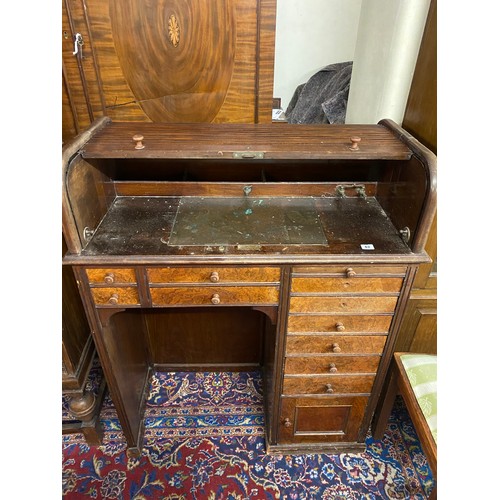 62 - A walnut dentists cabinet with tambour top, fitted ten drawers and cupboard - 37in. wide