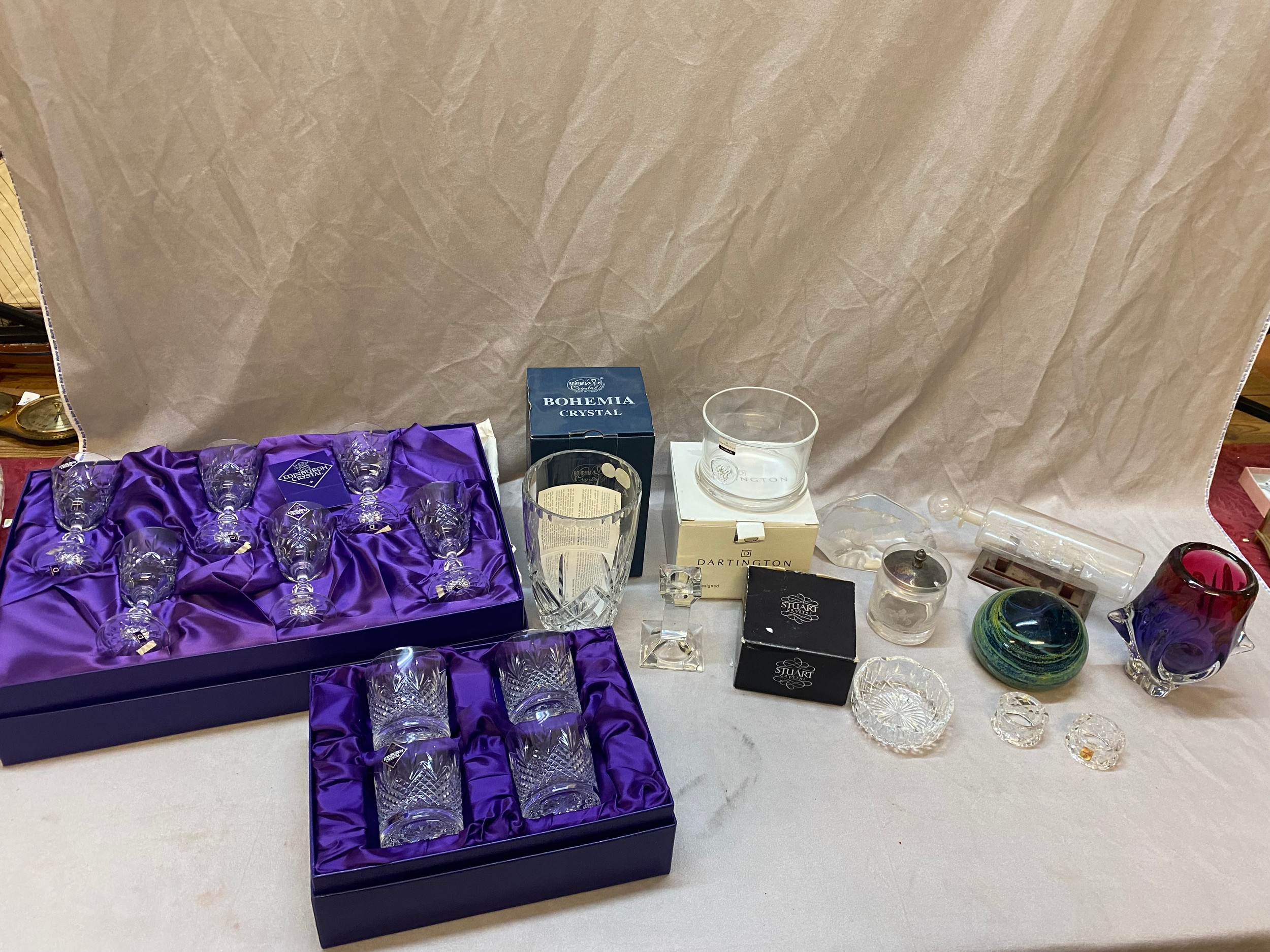An Edinburgh Crystal decanter, six tumblers, six white wines, all boxed