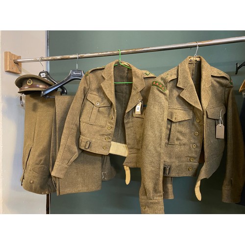 42 - Two 1950's Royal Army Dental Corp Captains battle dress jackets and trousers, a cap and boots