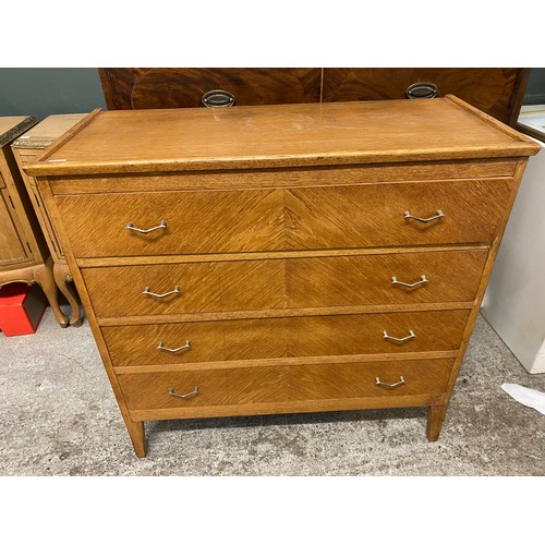 44 - An oak straight front chest fitted four wide drawers, on square legs - 36in. wide