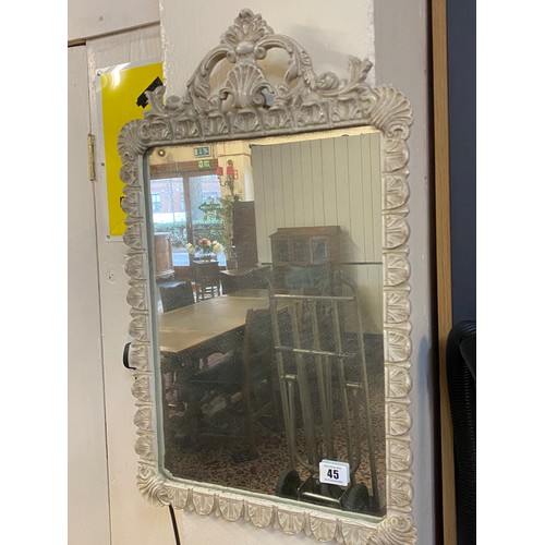 45 - A rectangular wall mirror in a cream painted frame with shell and anthemion leaf decoration - 23in. ... 