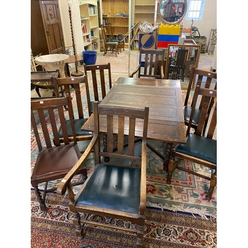 50 - An oak drawleaf dining table, a set of four oak framed dining chairs with vertical splats, a pair of... 