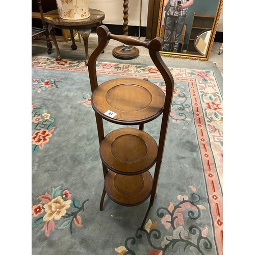 67 - An Edwardian mahogany three tier folding cakestand