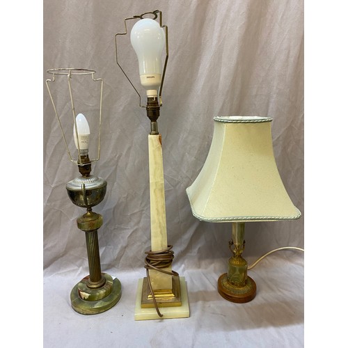 73 - A selection of tablelamps including onyx and gilt metal with square column, onyx with urn to the top... 