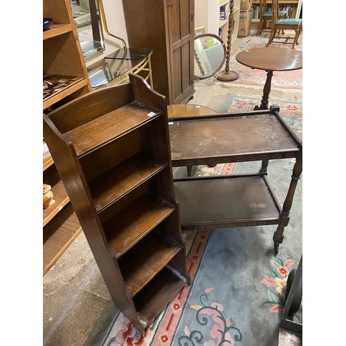 77 - An oak two tier tea trolley and an oak openfront bookcase fitted four shelves - 14in. wide