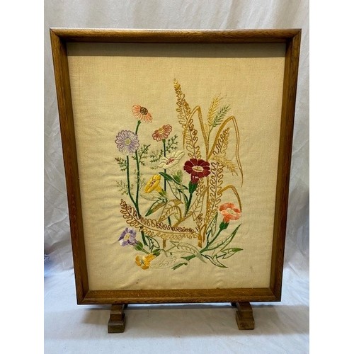 71 - A walnut framed firescreen inset embroidered panel