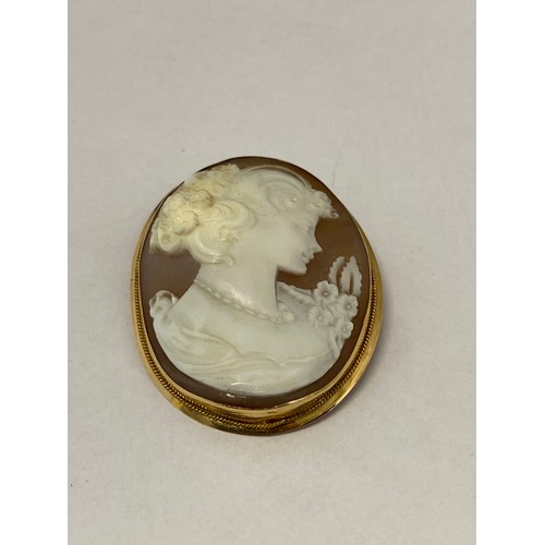 234 - A carved shell cameo mounted in an 18ct. gold frame as a brooch or pendant
