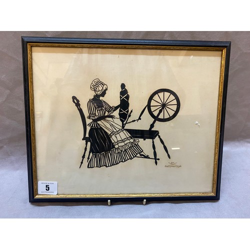 5 - A black and white silhouette by Eva Schonberg depicting a lady seated at a spinning wheel, framed an... 