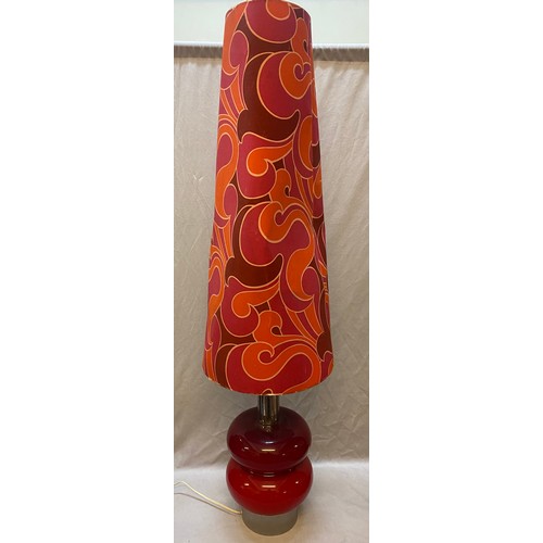 16 - A 1970's red glass and chrome floor lamp complete with shade