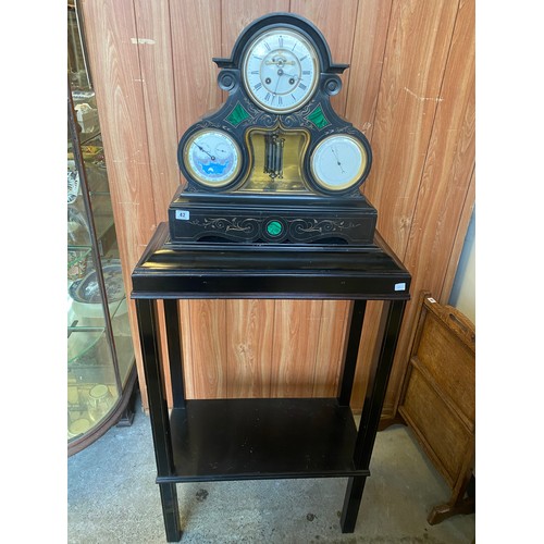 42 - A Victorian mantel clock with white enamel dial, visible escapement, day, date, month and moonphase ... 