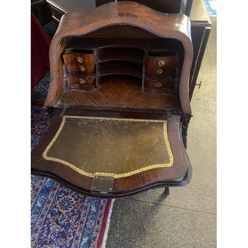 78 - A French rosewood and kingwood veneered bureau de dame, the hinged fall front with inlaid leaf sprig... 