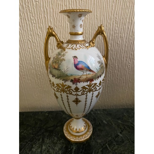 137 - A Royal Crown Derby vase of urn form, flared neck, gilt handles, white ground painted to one side wi... 