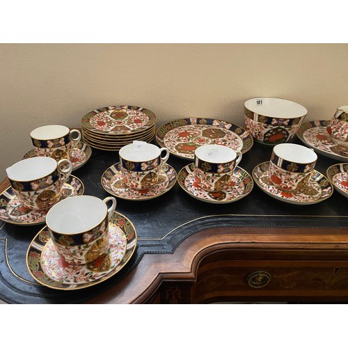 101 - A Crown Derby Imari pattern tea service comprising:- twelve cups, twelve saucers, twelve tea plates,... 