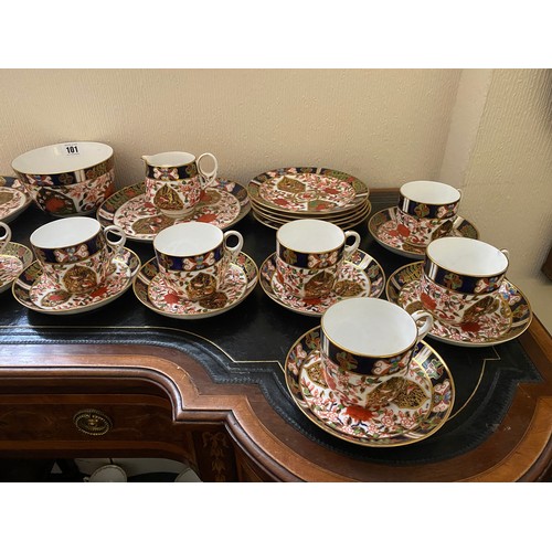 101 - A Crown Derby Imari pattern tea service comprising:- twelve cups, twelve saucers, twelve tea plates,... 