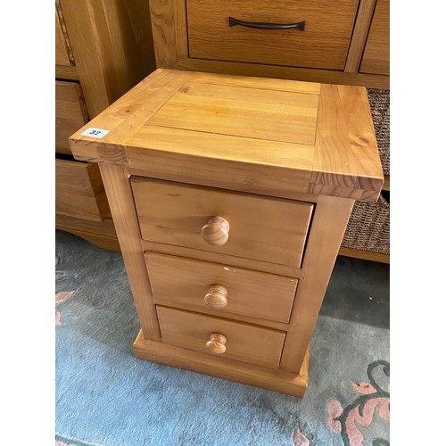 32 - A small pine chest fitted three drawers, on platform base - 15 1/2in. wide