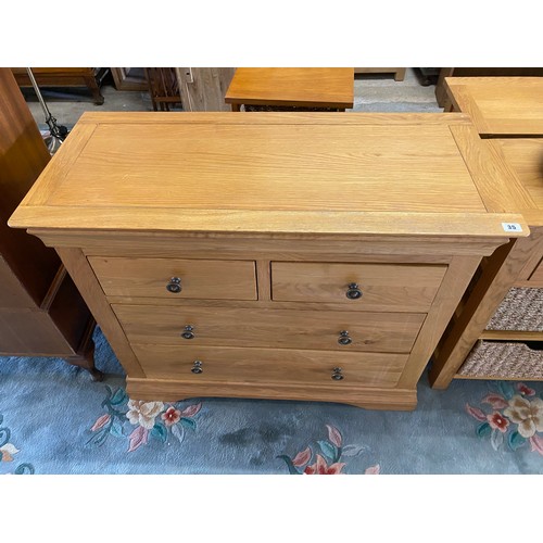 35 - A modern oak chest fitted two narrow and two wide drawers, on platform base - 38in. wide