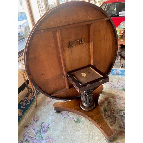 88 - A 19th Century rosewood breakfast table with circular hinged top, on turned and tulip form column, t... 