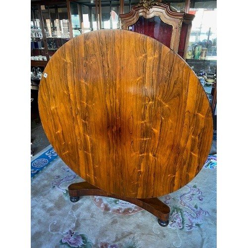 88 - A 19th Century rosewood breakfast table with circular hinged top, on turned and tulip form column, t... 