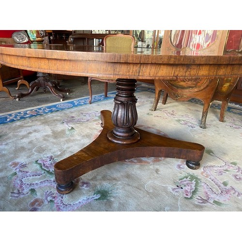 88 - A 19th Century rosewood breakfast table with circular hinged top, on turned and tulip form column, t... 