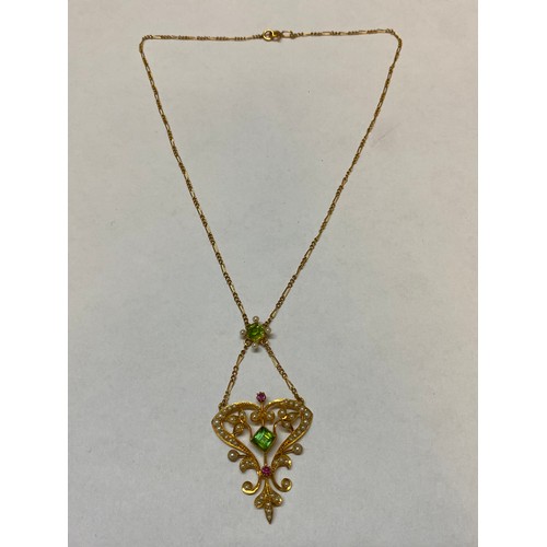 223 - A late Victorian 15ct. gold pendant set peridot and seed pearls, on a fine 15ct. gold chain