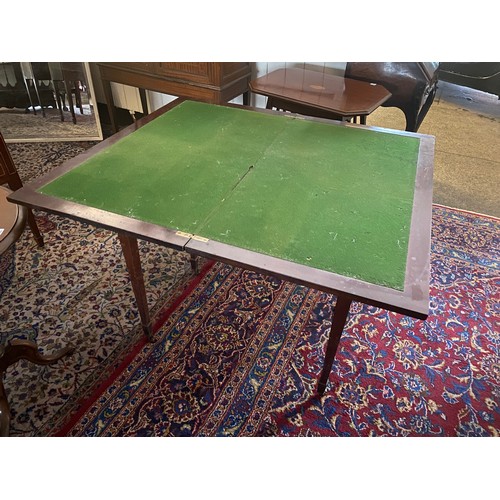 32 - A 19th Century mahogany card table with rectangular folding top, on square tapered legs terminating ... 