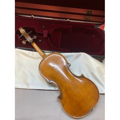 276 - A violin bearing the label to the inside for Guadagnini, dated 1870, in fitted carrying case, back l... 