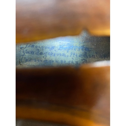 276 - A violin bearing the label to the inside for Guadagnini, dated 1870, in fitted carrying case, back l... 