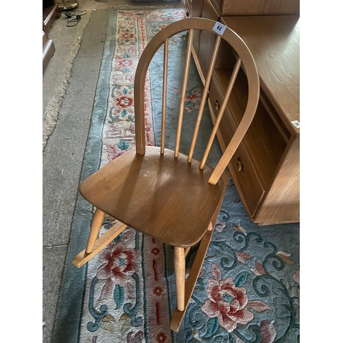 44 - An Ercol light elm framed rocking chair with hoop back