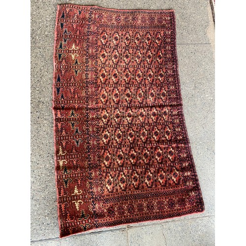 4 - A small Eastern rug, red field with forty eight medallions - 46in. x 27in. and a modern rug in cream... 