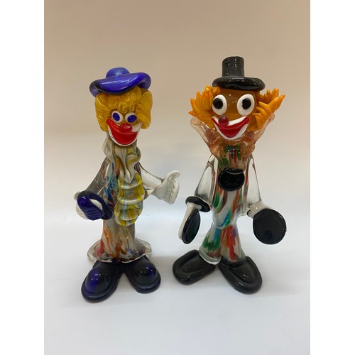 193 - A Murano model of a clown with black top hat and cymbals - 10 1/2in. high and one other with blue ha... 