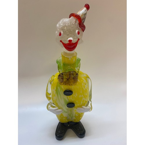 194 - A Murano decanter in the form of a clown in yellow and white with red multi coloured hat - 15 3/4in.... 