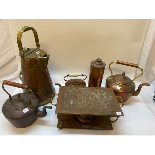 320 - A selection of copper including a pail, three kettles, trivet etc..