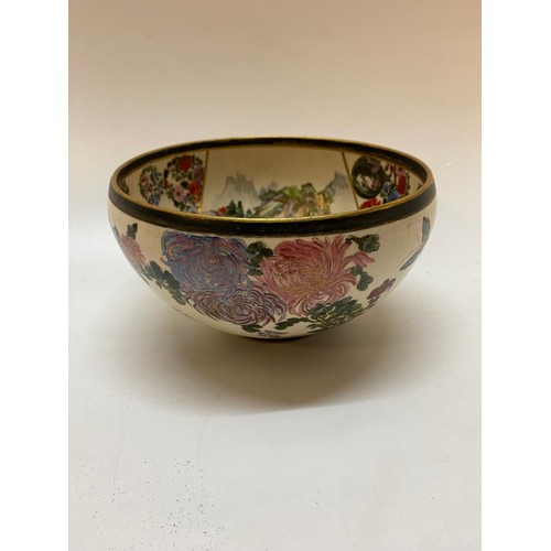 182 - A late 19th Century Japanese Satsuma bowl decorated pagodas, butterflies and flowers - 6in. dia.