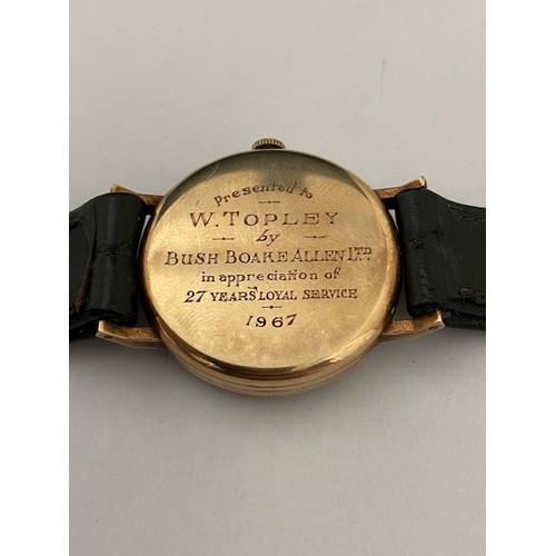 219 - A gentleman's Vertex Revue wristwatch in a 9ct. gold case, on black leather strap