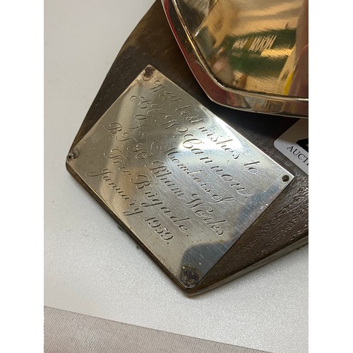 249 - A fireman's silver plated helmet mounted on a wooden base with silver plated plaque inscribed 'With ... 