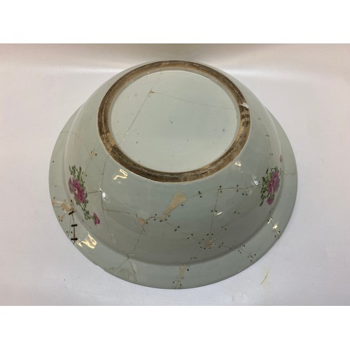 127 - A large 19th Century Cantonese toilet bowl decorated in alternate reserves with figures in interiors... 